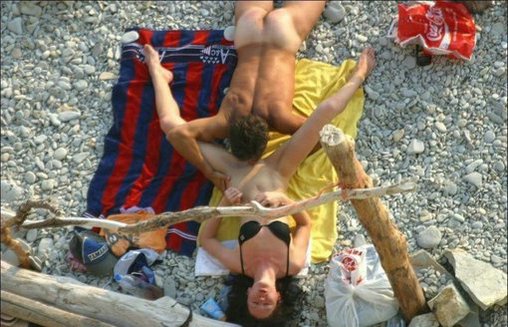Husband Licks and Eats Wifes Pussy in Public Beach Photo